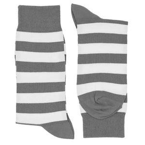 A pair of gray and white striped crew socks, folded flat