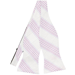 Untied front view of a white and light purple plaid self-tie bow tie