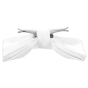 A white clip-on bow tie, opened and ready to attach