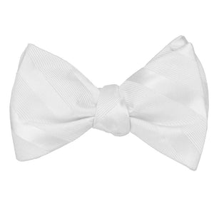 A white tone on tone striped self-tie bow tie, tied