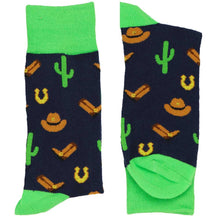 Load image into Gallery viewer, A folded pair of navy and lime green socks with a cowboy theme