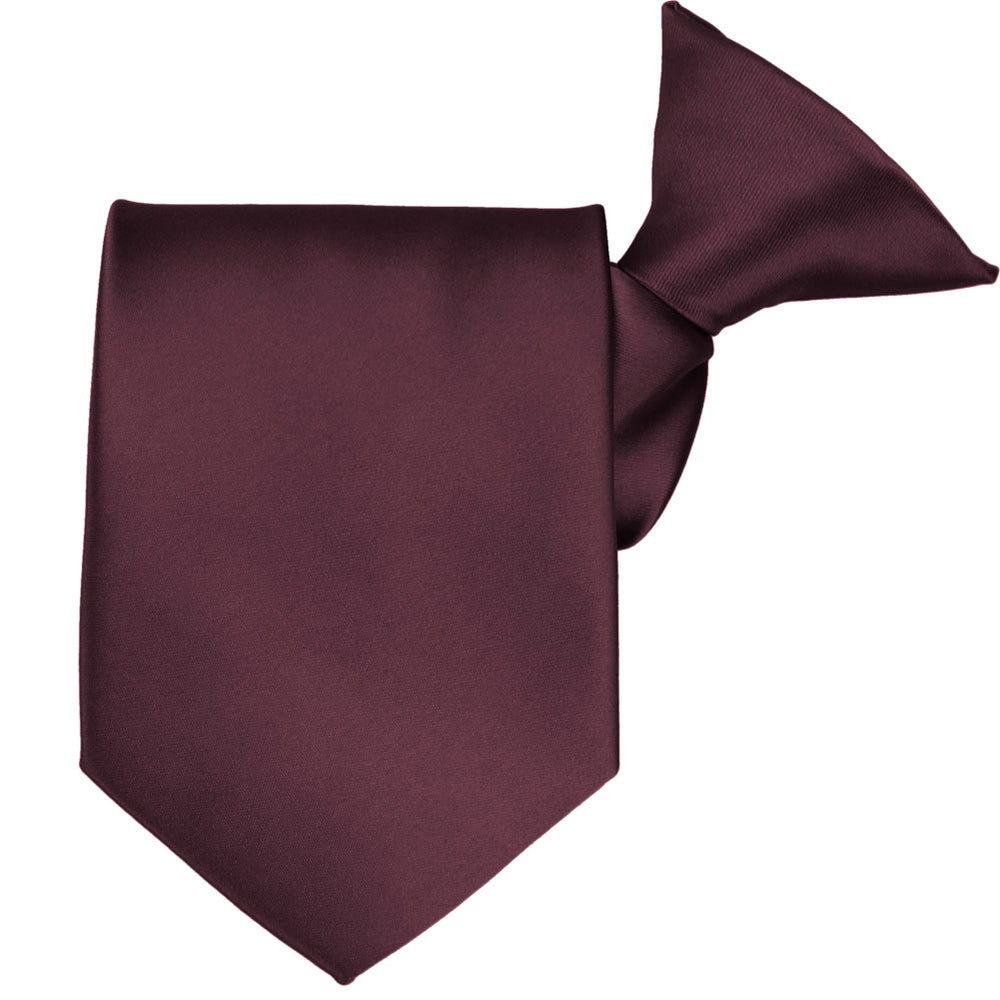 A rolled wine colored clip-on tie
