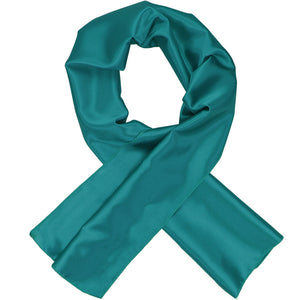 A women's deep aqua solid scarf, crossed over itself