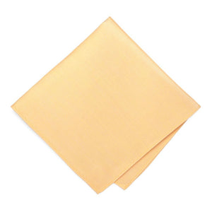 A folded soft yellow pocket square with a linen texture