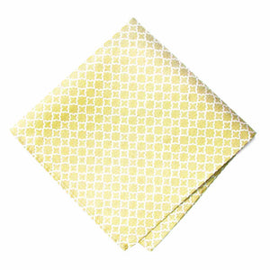 A folded soft yellow pocket square with a white trellis pattern